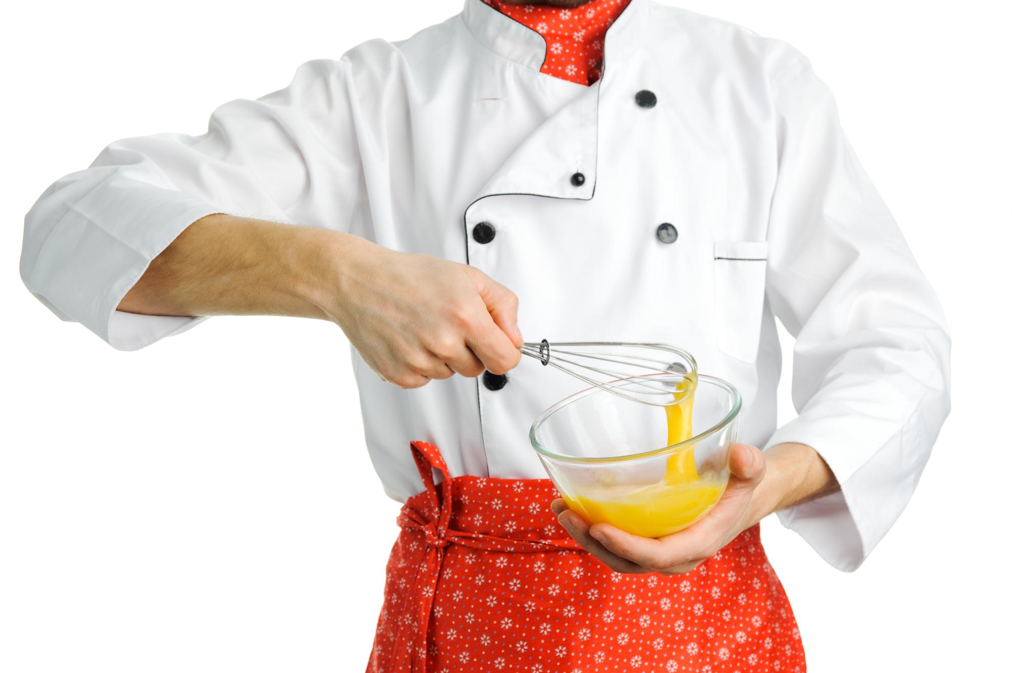 Chef hands arranging garnish on dish